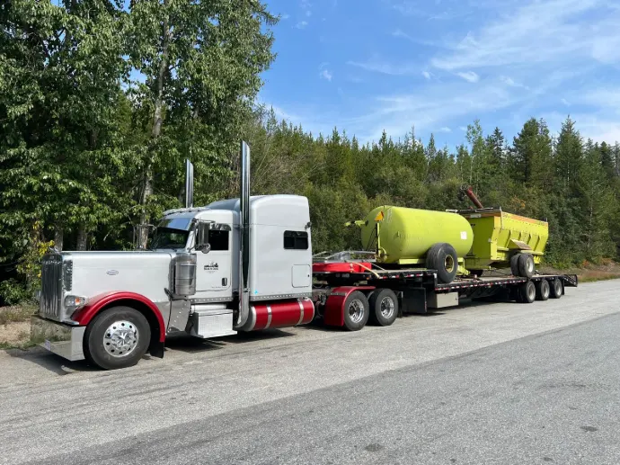 Truck with a load of farm equipment